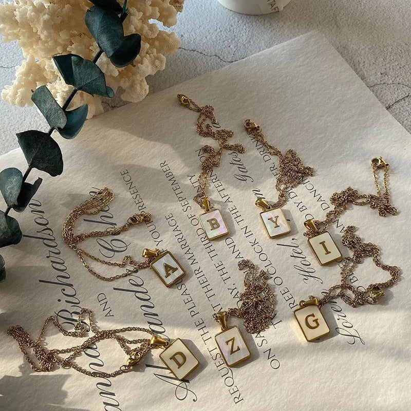 E.B.belle Minimalist Mother of Pearl Shell Stainless Steel Tarnish Free Initial Necklace Gold Plated Letter Necklace for Women