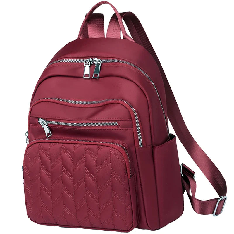 Men's and women's fashionable backpack made of nylon, suitable for travel, tourism and photography. It has multiple pockets.