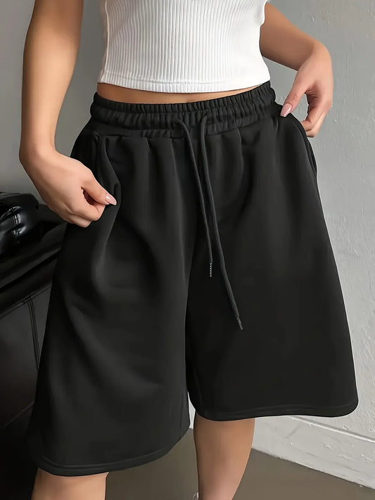 Plus-size women's casual style solid color sweatshirt and shorts with drawstring waist and pockets for everyday casual wear.