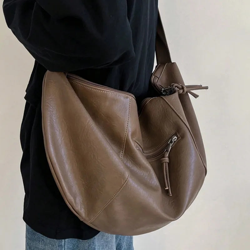 Stylish Dumpling Shaped PU Crossbody Bag for Men, Suitable for Casual Outings and Large Capacity Needs