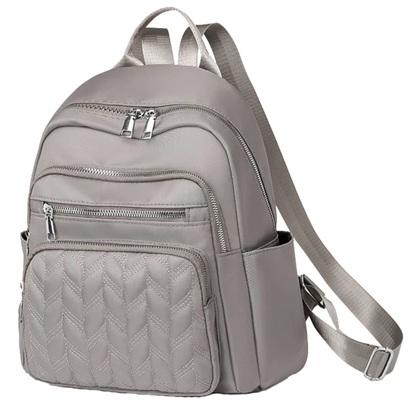Men's and women's fashionable backpack made of nylon, suitable for travel, tourism and photography. It has multiple pockets.